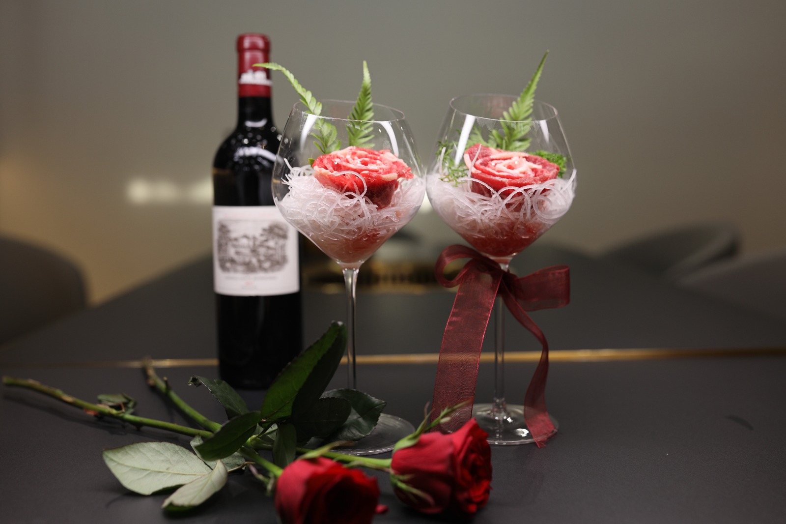 Signature rose beef presented in crystal wine glasses